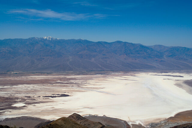 Salt below, and in the background – snow on the Sierra Nevada mountains / View from Dante's View of Badwater
